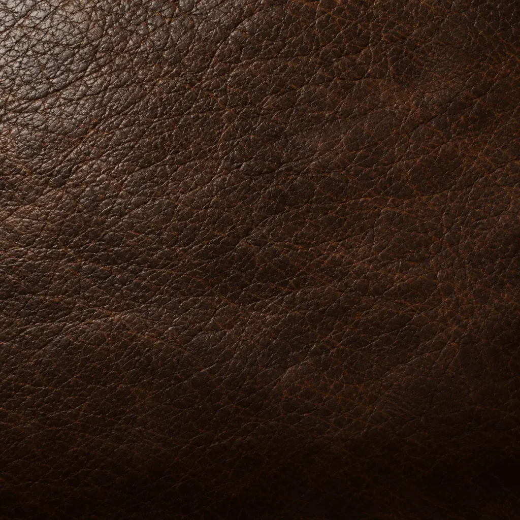 Close-up of dark brown cowhide leather with a natural pebble grain